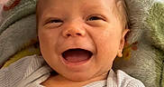 Malachai is registered to the contest to win money with this photo: baby, babylaughing, clothing, face, happy, head, hosiery, laughing, person, photography, portrait, smile, sock