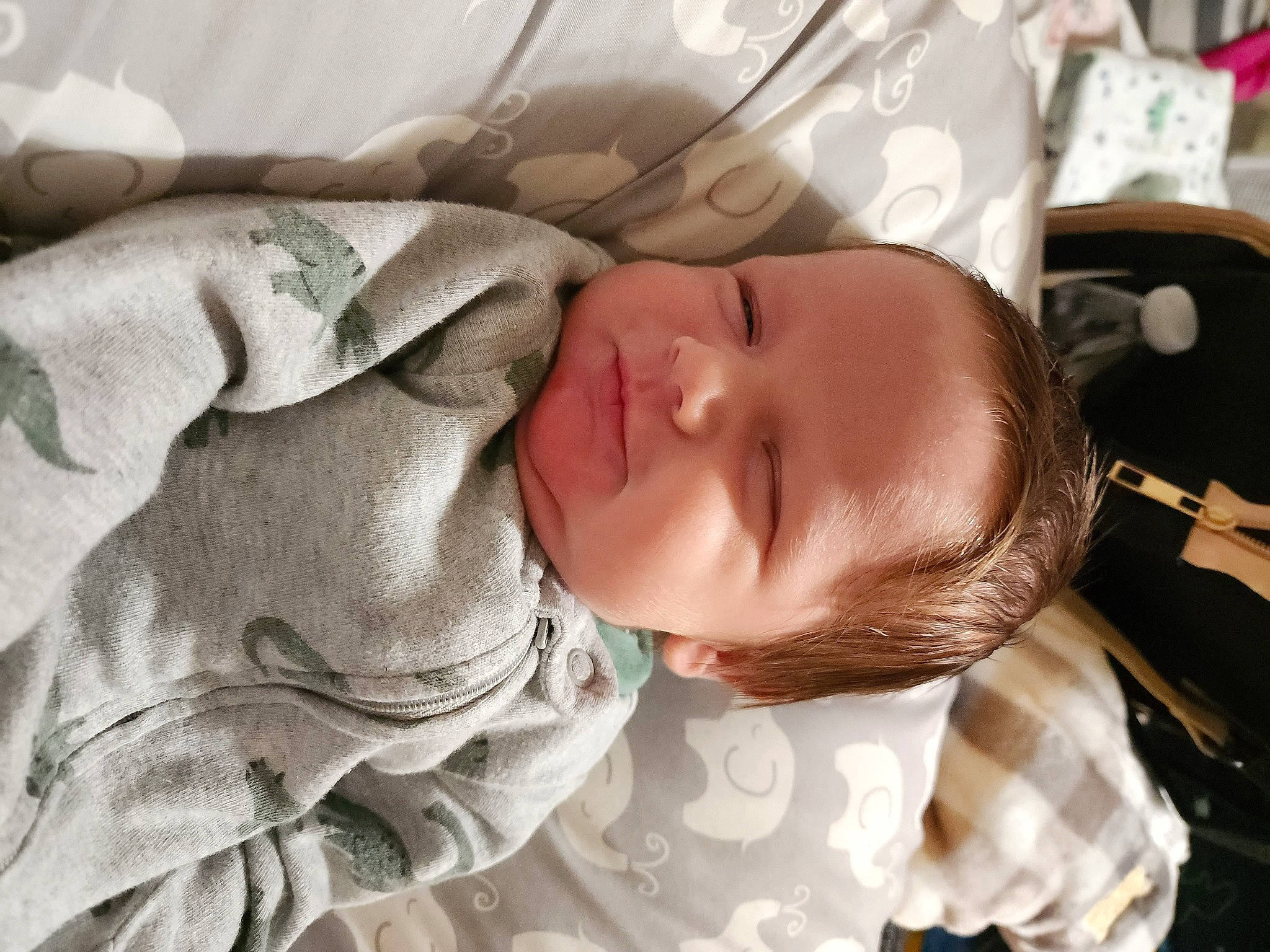 Josiah is registered to the contest to win money with this photo: baby, baby_products, baby_safety, baby_sleeping, baby_toddler_clothing, bedding, bedtime, child, comfort, facial_expression, linens, nap, pattern, person, product, room, skin, sleep, sleeve, textile