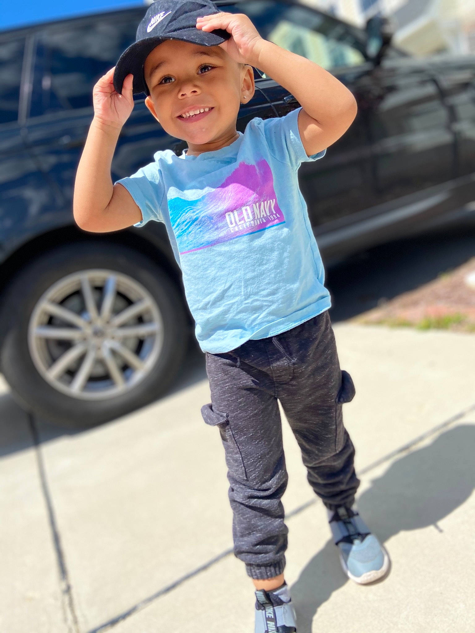 Deauntra joined the competition — help win amazing prizes! asphalt, automotive_design, automotive_tire, bumper, car, cool, eyewear, face, headwear, joy, leg, motor_vehicle, person, photograph, rolling, sleeve, standing, street_fashion, t_shirt, tire