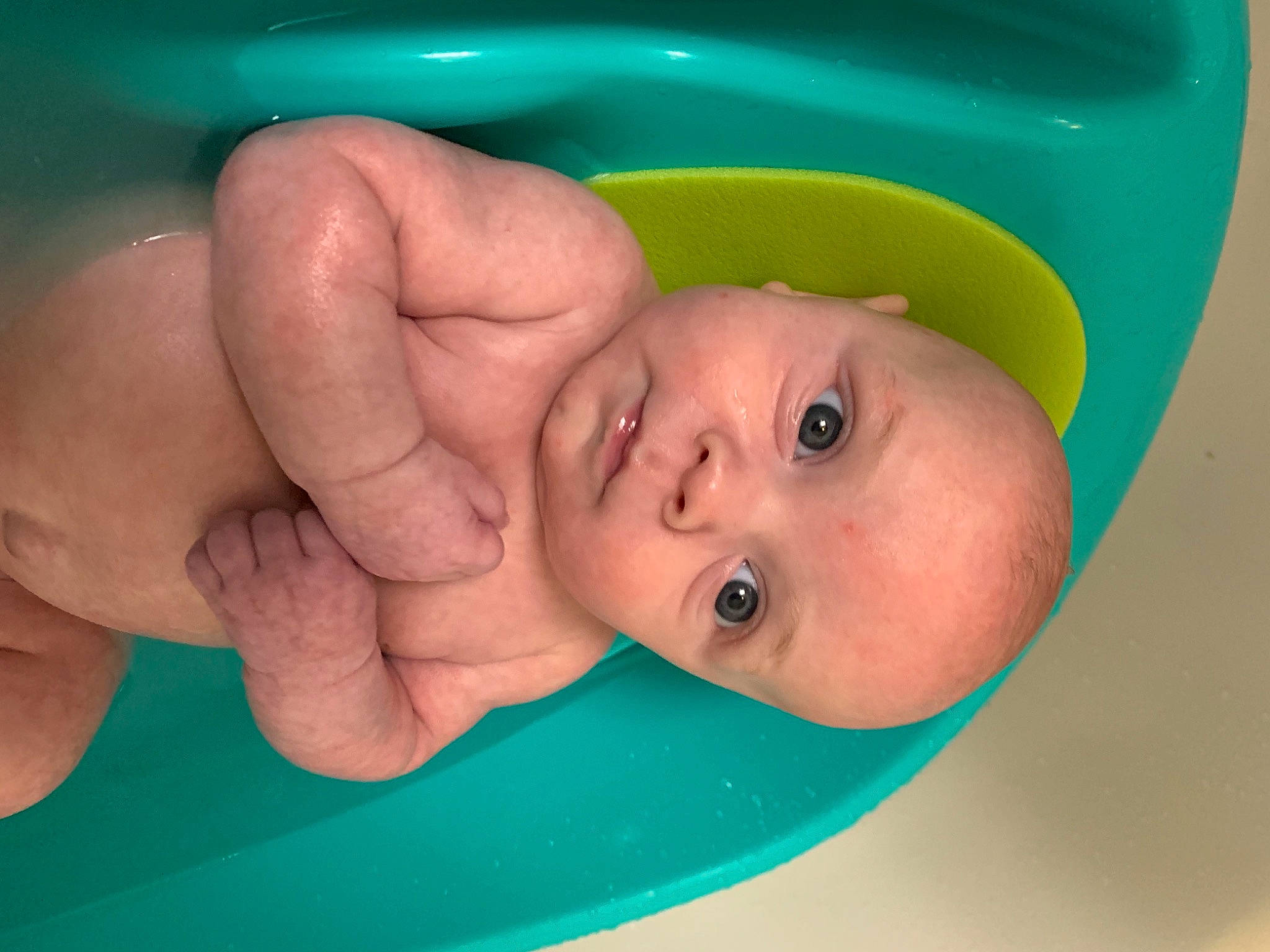 Alistair joined the competition — help win amazing prizes! baby, baby_bathing, bathing, bathtub, child, eye, fun, hand, nose, person, skin, smile, toddler, tummy_time