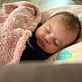 Eliana is registered to the contest to win money with this photo: baby, blanket, sleeping, infant, face, pillow, soft, cozy, indoors, child, peaceful, cute, resting, comfort, pink, clothing, head, eyelashes, young, nap