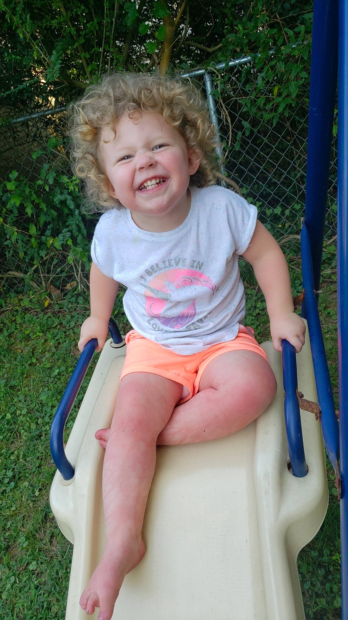 Jayde is registered to the contest to win money with this photo: baby, baby_products, child, facial_expression, fun, joy, leisure, outdoor_play_equipment, person, play, playground, product, public_space, recreation, sitting, smile, summer, swing, toddler, vacation