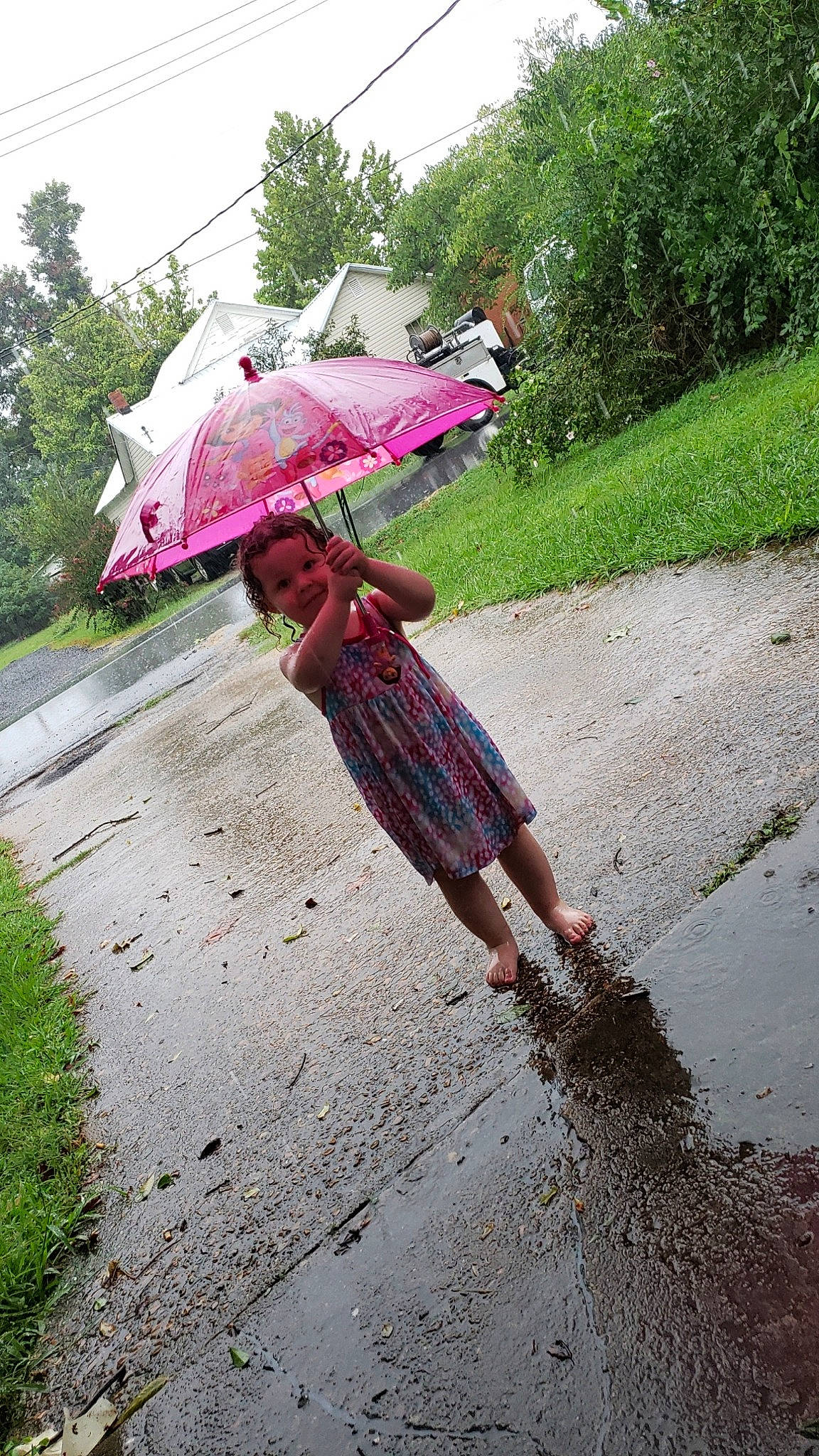 Jayde joined the competition — help win amazing prizes! bicycle, bicycle_accessory, bicycle_wheel, cycling, fashion_accessory, grass, mountain_bike, person, pink, plant, puddle, rain, recreation, road, soil, umbrella, vehicle