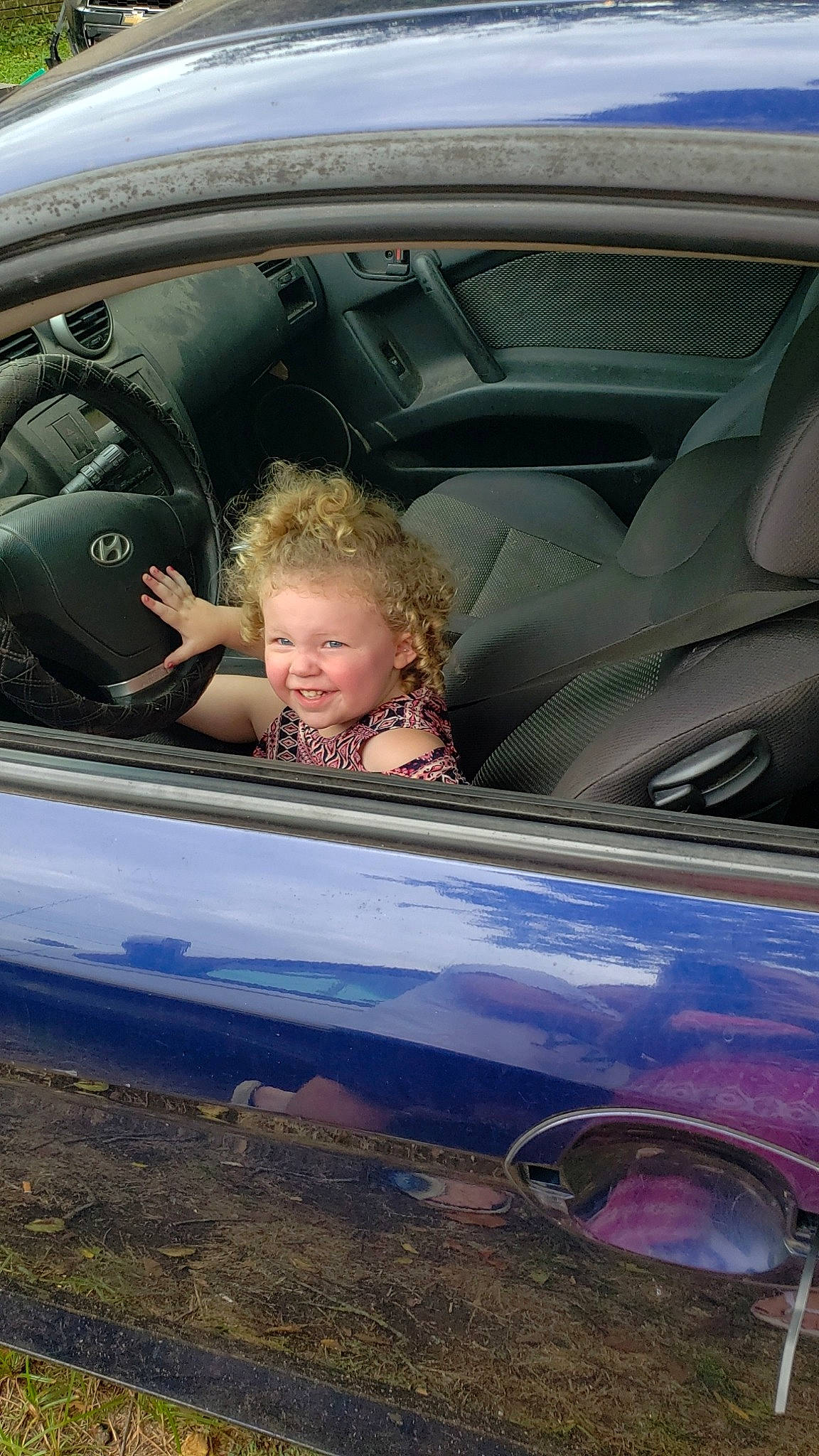 Jayde is registered to the contest to win money with this photo: auto_part, automotive_design, automotive_exterior, automotive_window_part, car, city_car, driving, family_car, glass, luxury_vehicle, motor_vehicle, person, personal_luxury_car, plant, steering_wheel, vehicle, vehicle_door