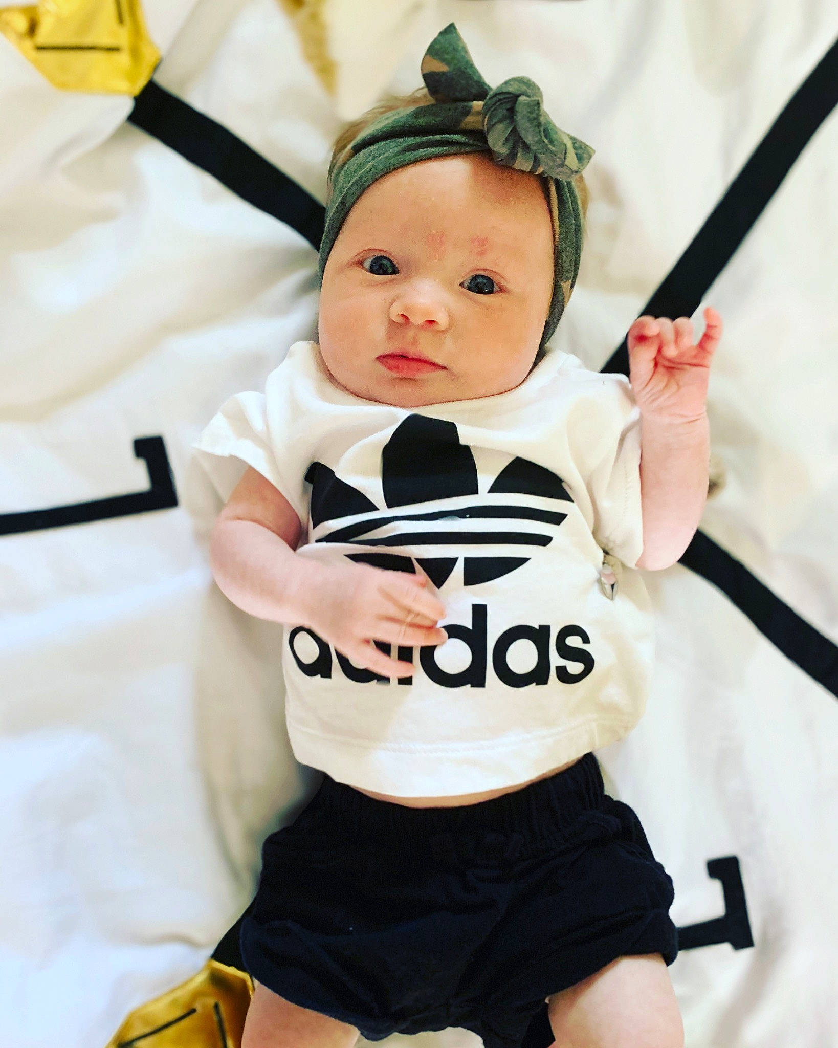 Taylor is registered to the contest to win money with this photo: baby, baby_products, child, clothing, costume, headwear, outerwear, person, product, sleeve, t_shirt, toddler, uniform