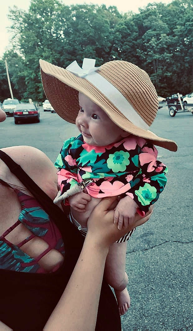Taylor is registered to the contest to win money with this photo: baby, child, cool, fashion_accessory, fedora, hand, hat, headgear, headwear, joint, leg, person, photography, pink, plant, skin, summer, sun_hat, toddler, turquoise