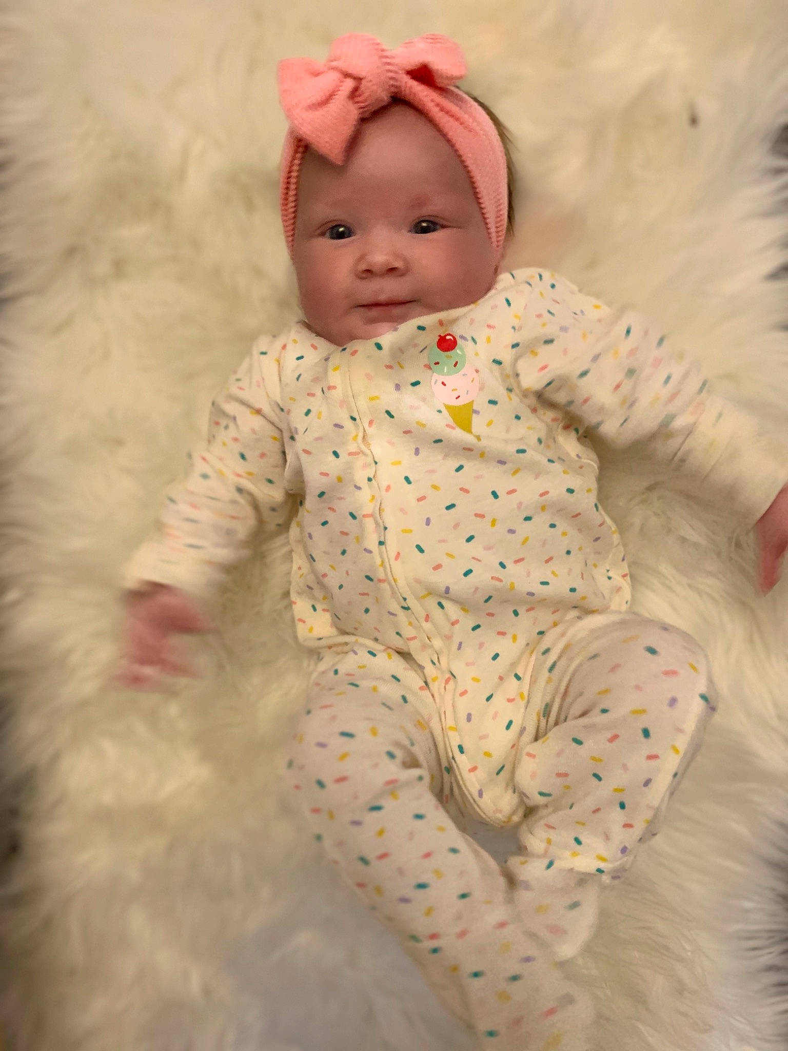 Taylor is registered to the contest to win money with this photo: baby, baby_toddler_clothing, cheek, child, doll, eye, fur, headwear, iris, person, pink, skin, sleeve, toddler
