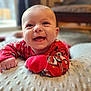 Eric is registered to the contest to win money with this photo: baby, blanket, cheerful, child, closeup, crawling, cute, expression, face, happy, indoors, infant, person, playful, portrait, red_clothing, skin, smiling, soft_texture, young
