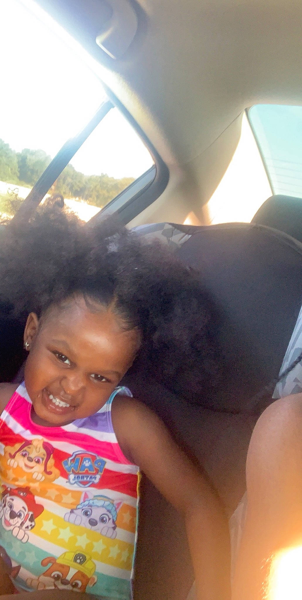 Cherish is registered to the contest to win money with this photo: black_hair, car_seat, child, face, hair, joy, mouth, nose, person, photography, selfie, skin, smile, toddler