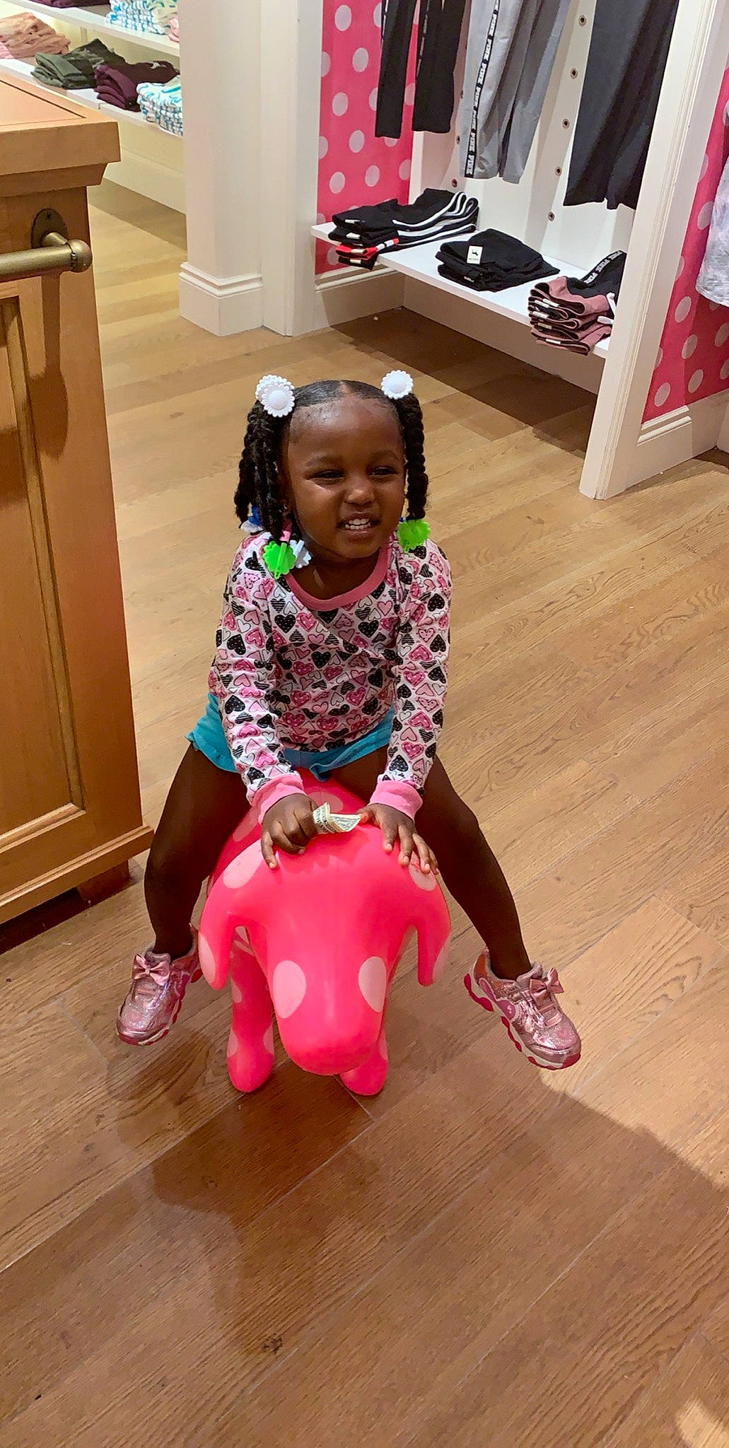 Cherish is registered to the contest to win money with this photo: child, floor, flooring, hardwood, joy, person, pink, play, sitting, toddler