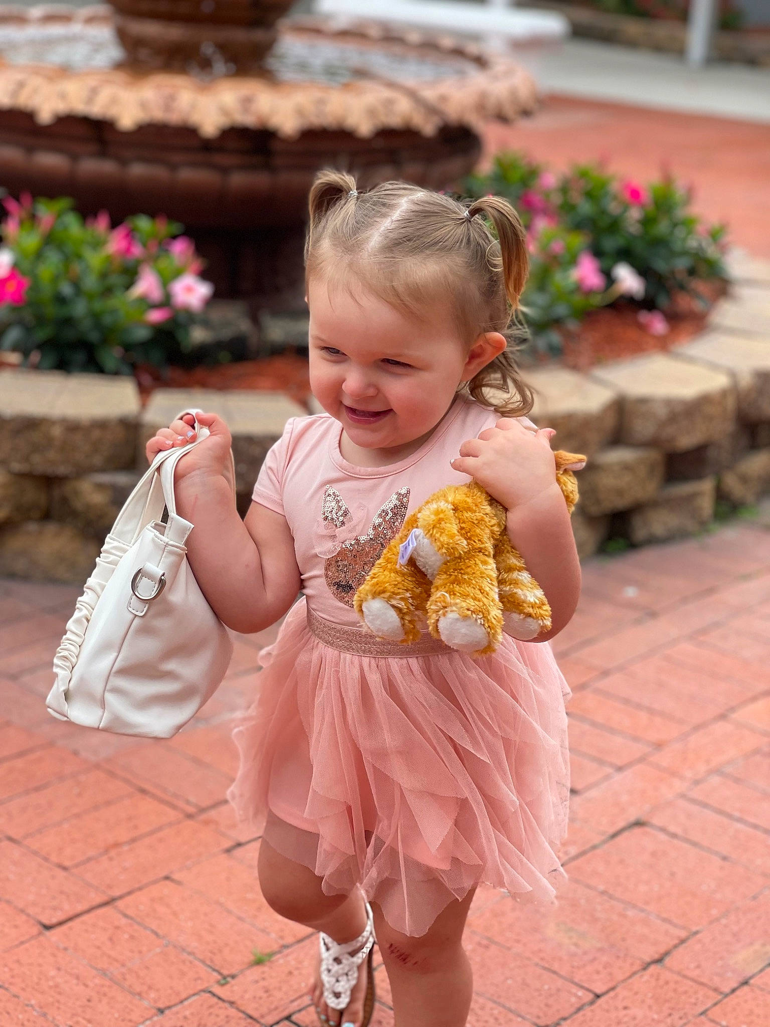 Amelia joined the competition — help win amazing prizes! baby, baby_toddler_clothing, child, event, face, flower, fun, grass, happy, iris, joy, leisure, person, pink, plant, sandal, sitting, skin, smile, snapshot