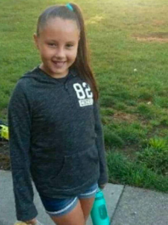 Belicia is registered to the contest to win money with this photo: child, clothing, cool, facial_expression, fun, grass, hair, joint, joy, lady, leg, people, person, photograph, shorts, shoulder, smile, snapshot, standing, t_shirt