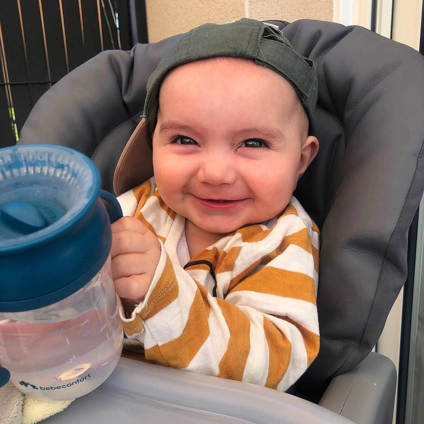 Louis participe au concours pour gagner de l'argent avec cette photo : baby, bodypart, clothing, coat, cushion, cutlery, face, finger, hand, happy, hat, head, homedecor, jacket, jar, person, photography, portrait, smile, spoon