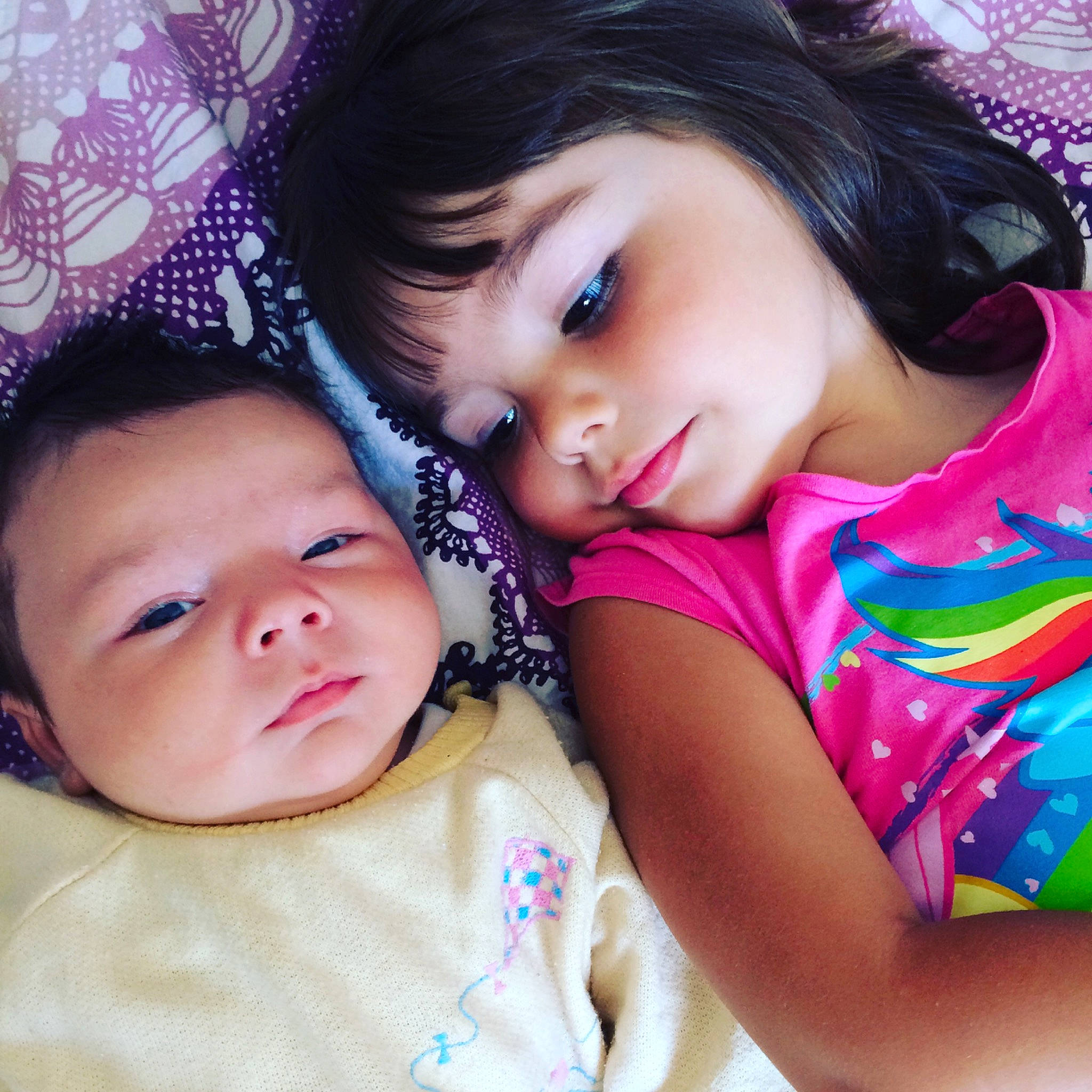 Ellie participe au concours pour gagner de l'argent avec cette photo : baby_toddler_clothing, beauty, black_hair, cheek, child, eye, eyebrow, eyelash, face, forehead, head, iris, lip, magenta, mouth, nose, person, pink, skin, toddler