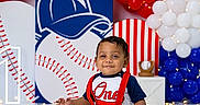 Kashton joined the competition — help win amazing prizes! baby, boy, cake, birthday, first_birthday, baseball, balloons, red, white, blue, celebration, smiling, face, hands, floor, decorations, sitting, party, festive, cute