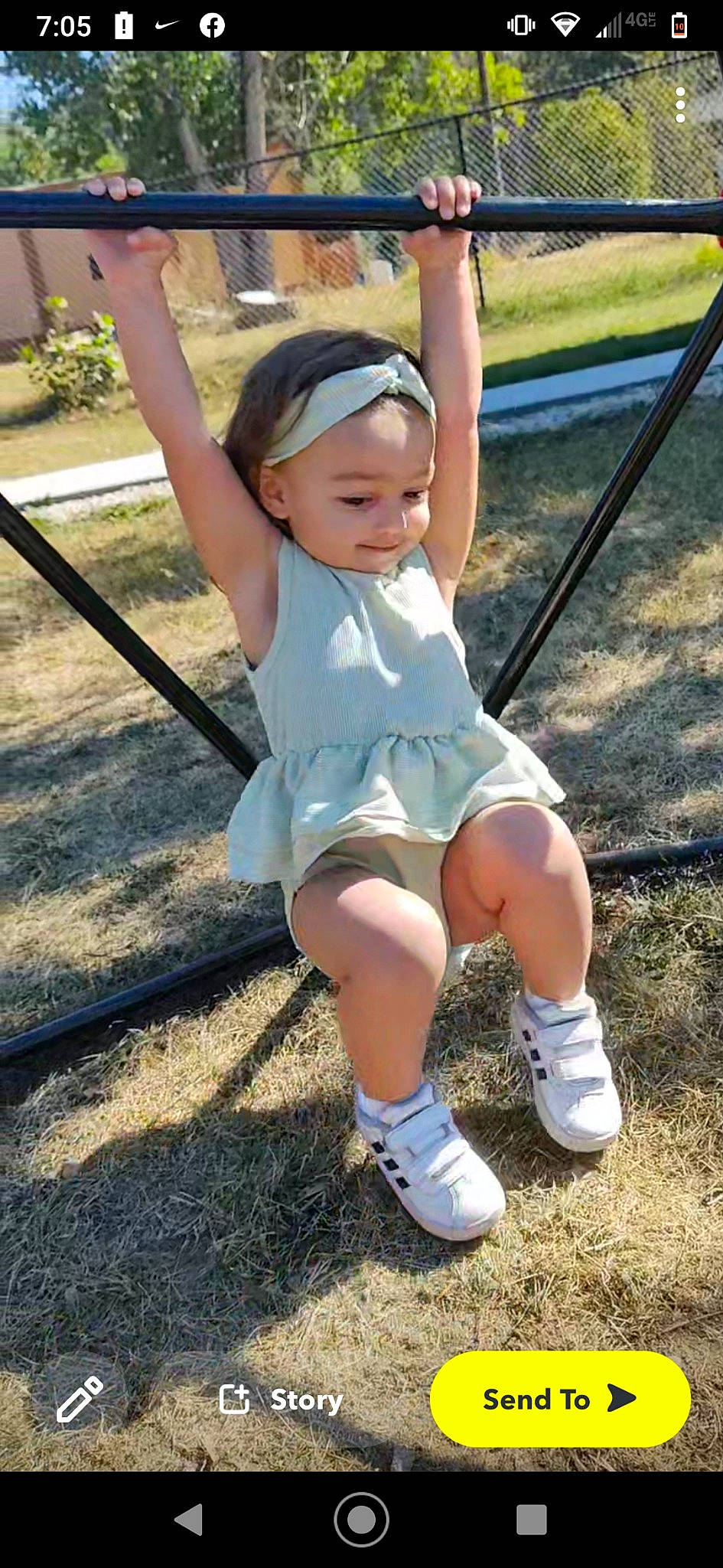 Naleyah joined the competition — help win amazing prizes! baby_toddler_clothing, child, face, fun, grass, happy, hat, human_leg, leg, leisure, outdoor_play_equipment, people_in_nature, person, plant, play, recreation, sitting, soil, swing, toddler