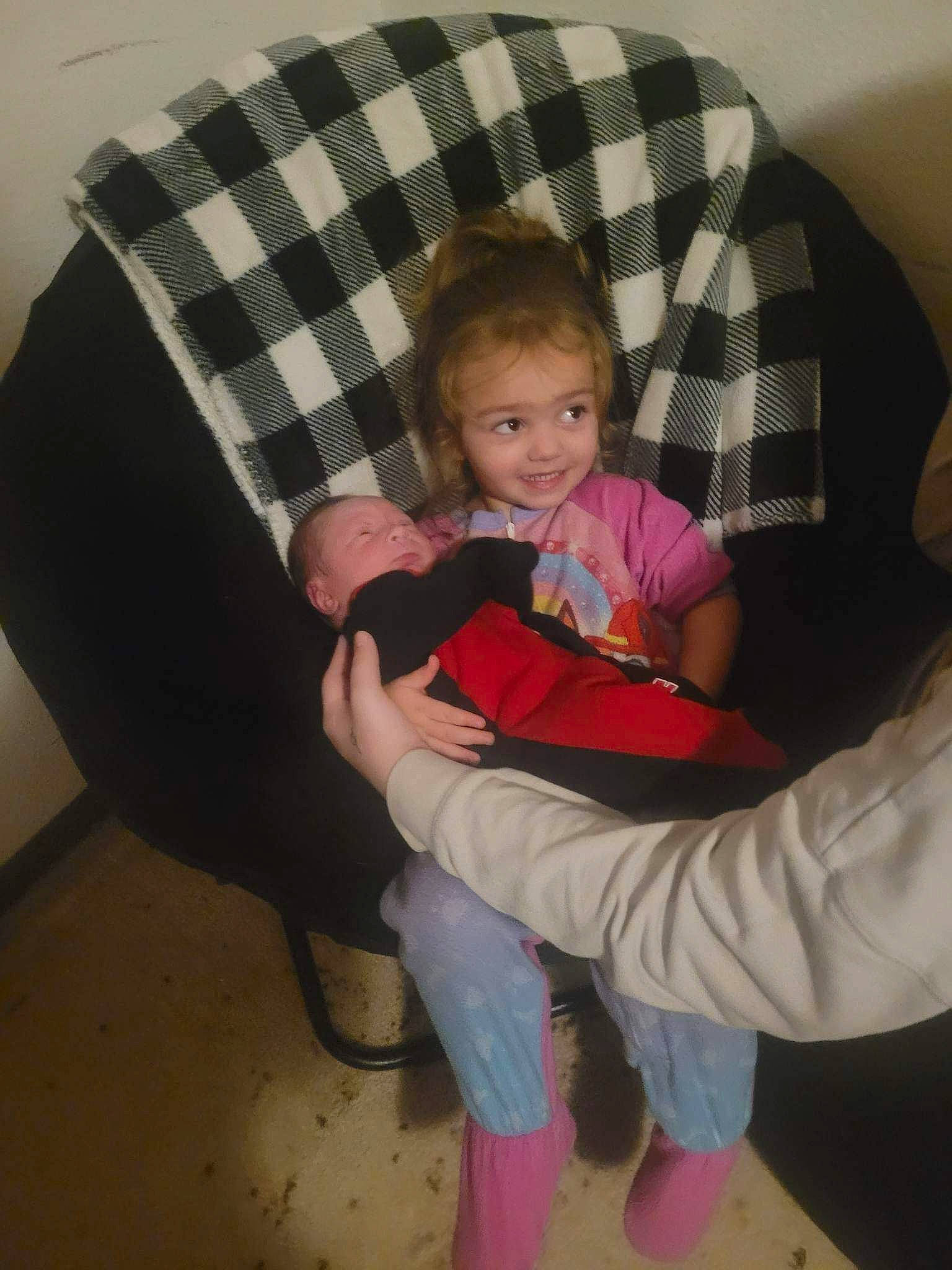 Naleyah is registered to the contest to win money with this photo: chair, comfort, couch, finger, fun, human_leg, joy, knee, lap, leg, person, pillow, plaid, shoe, sitting, smile, sneakers, sock, tartan, textile