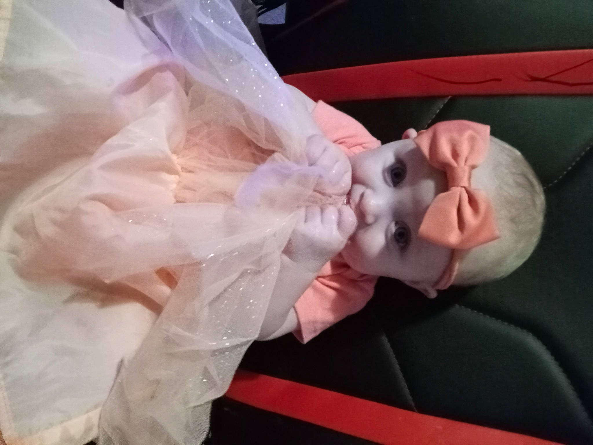 Alora is registered to the contest to win money with this photo: art, bridal_accessory, child, costume, doll, dress, embellishment, event, eyelash, fashion_accessory, flesh, hair_accessory, headpiece, peach, person, pink, plastic, sculpture, statue