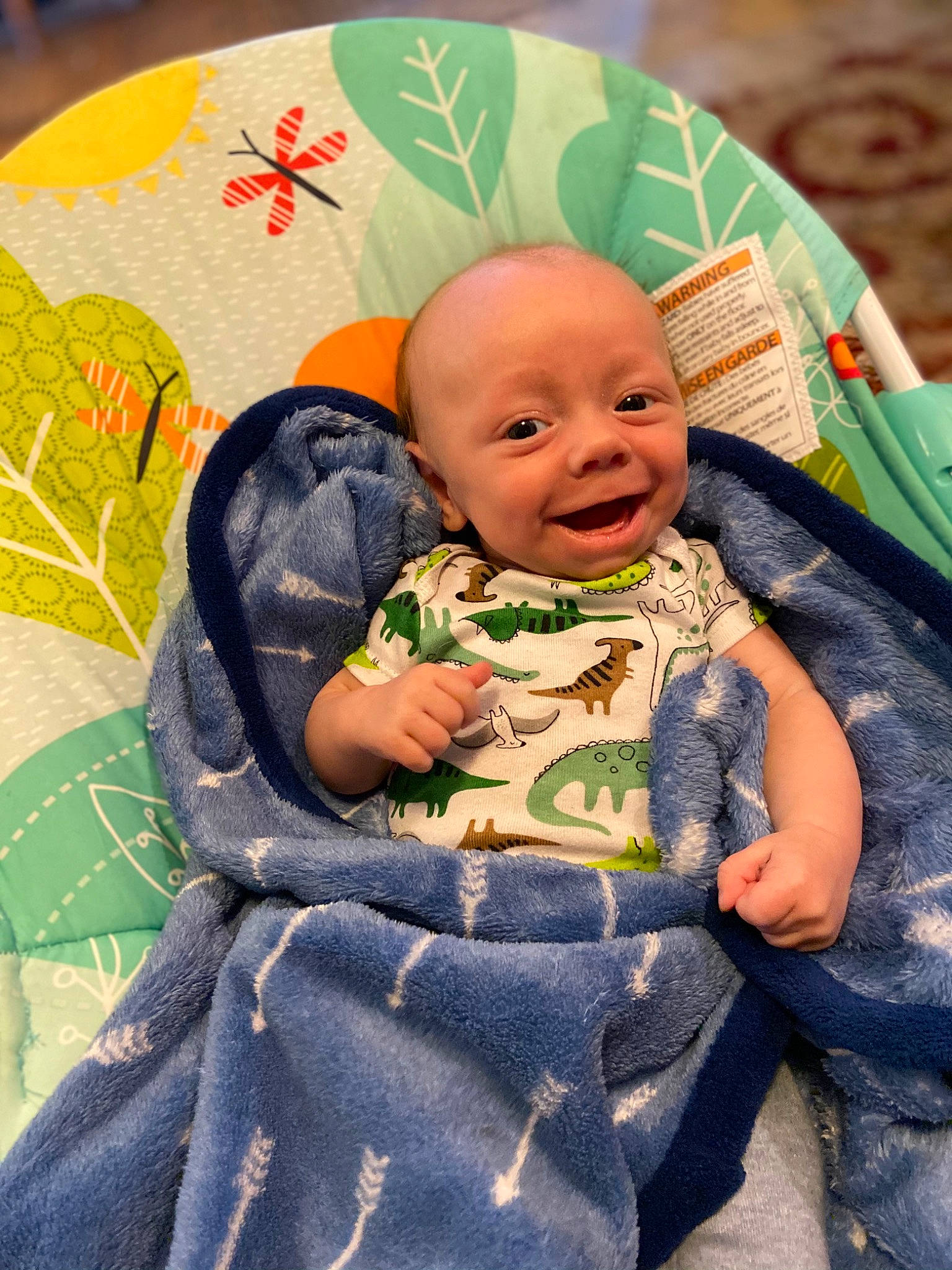 Everest is registered to the contest to win money with this photo: baby, cheek, child, eye, face, green, head, iris, leaf, people, person, sitting, skin, smile, toddler