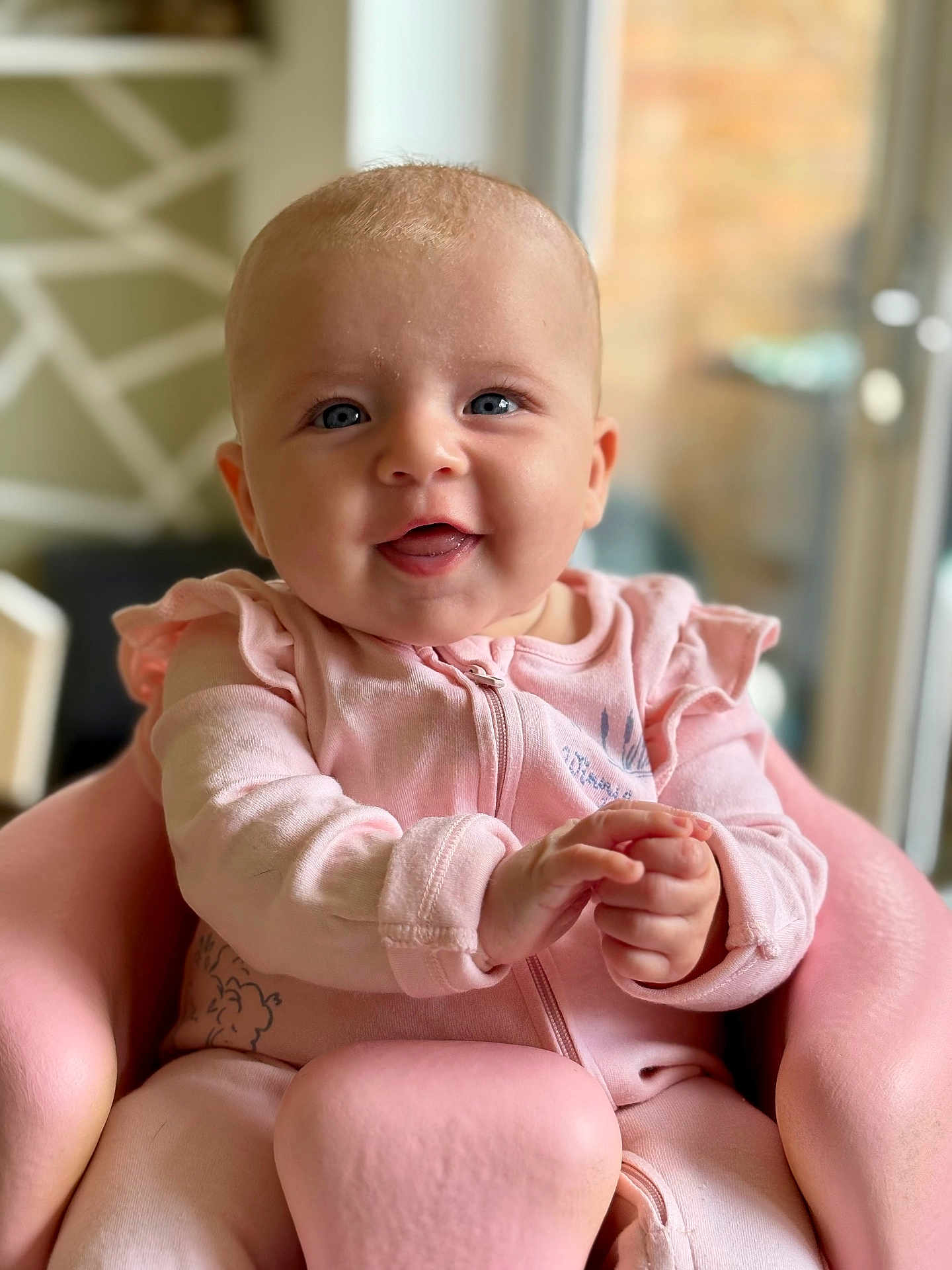 Wilma joined the competition — help win amazing prizes! baby, infant, pink_clothing, smiling, happy, child, portrait, indoor, seat, hands, face, blue_eyes, cute, young_child, soft_lighting, closeup, sitting, furniture, cozy, background_blur