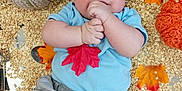 Tommy joined the competition — help win amazing prizes! baby, infant, oats, knitted_pumpkin, autumn_leaves, blue_shirt, gray_pants, hand, face, smiling, lying_down, floor, fall, seasonal, cute, child, portrait, indoors, soft_texture, cozy