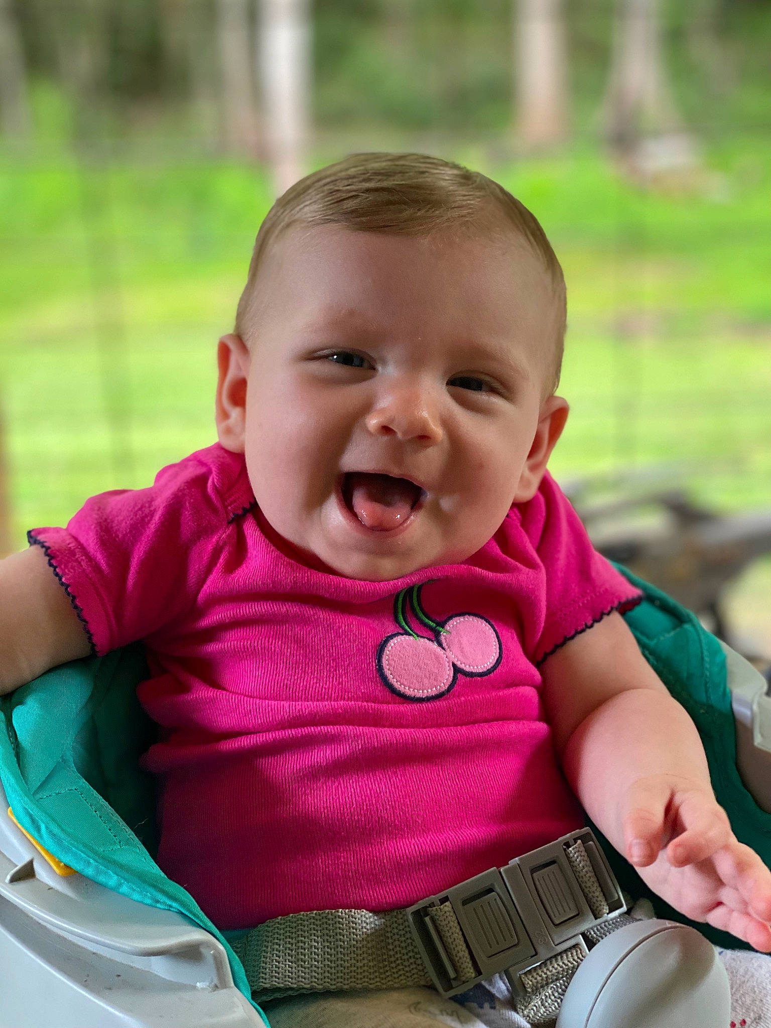 Caroline joined the competition — help win amazing prizes! baby, baby_toddler_clothing, chair, cheek, child, facial_expression, fun, grass, happy, leisure, magenta, person, pink, product, recreation, sitting, skin, sleeve, smile, tableware