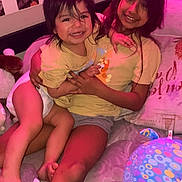 Violet joined the competition — help win amazing prizes! children, smiling, indoor, bed, toy, blanket, happy, family, sibling, child, casual_clothing, wall_photos, decor, playful, toddler, girl, infant, cozy, candid, home