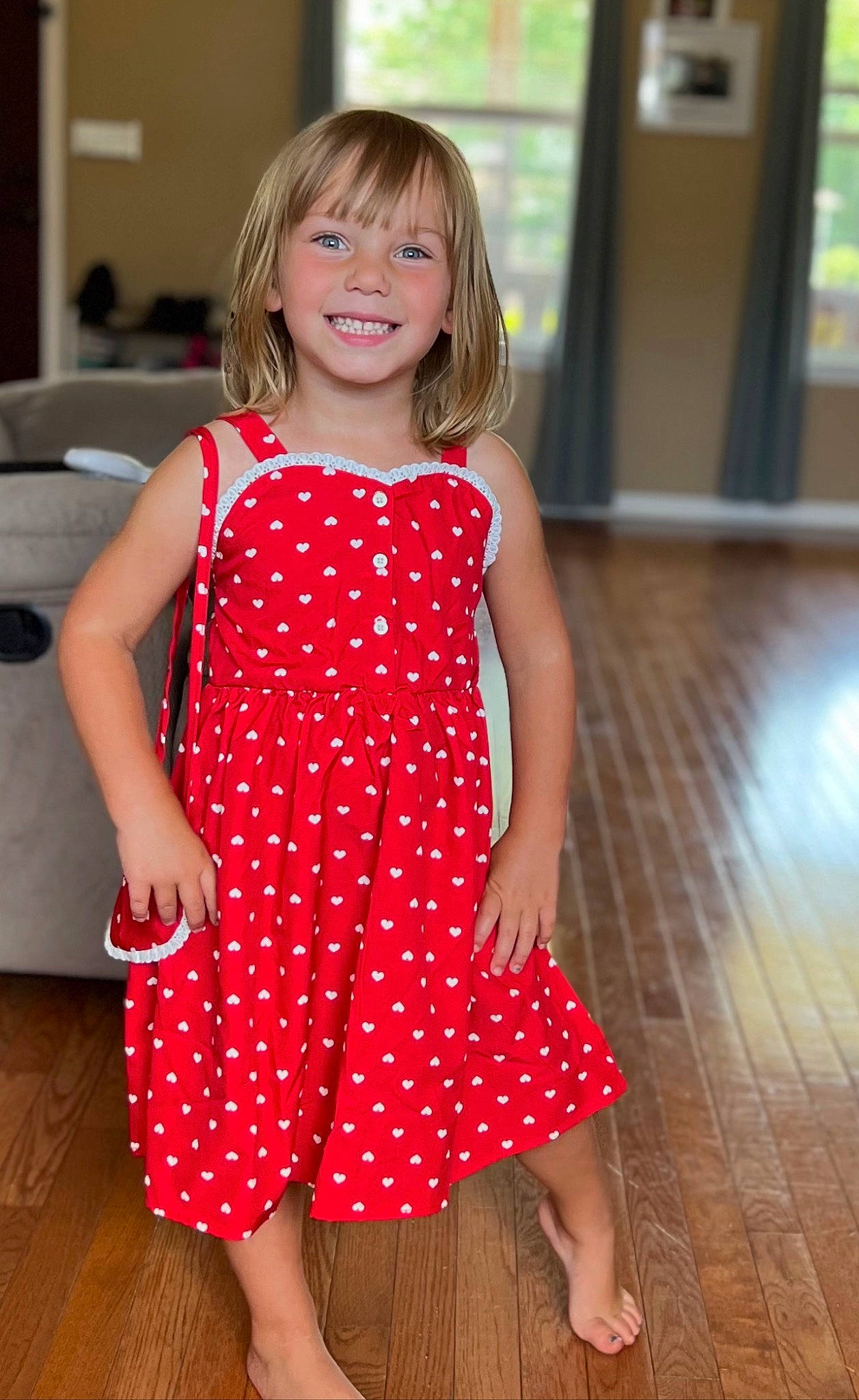 Layla is registered to the contest to win money with this photo: arm, day_dress, dress, face, facial_expression, fashion_design, flooring, formal_wear, fun, hair, happy, human_leg, joy, long_hair, one_piece_garment, person, shoulder, skin, smile, thigh