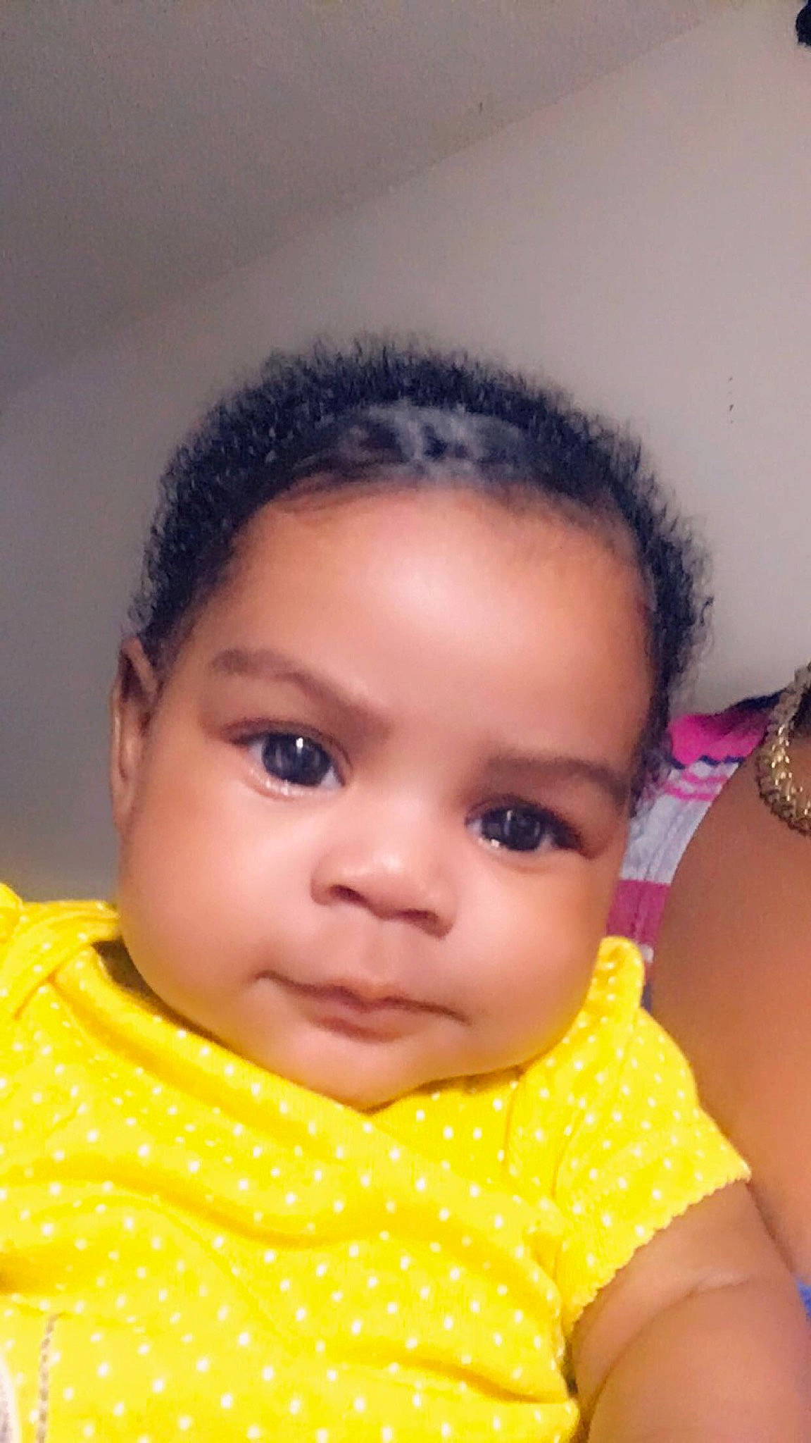 Makaylo is registered to the contest to win money with this photo: baby, beauty, black_hair, cheek, child, chin, close_up, eye, eyebrow, face, forehead, hair, head, lip, mouth, nose, person, pink, skin, toddler