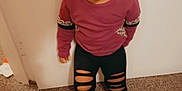 Amiyah is registered to the contest to win money with this photo: bodypart, clothing, face, finger, hand, happy, head, indoors, laughing, longsleeve, mouth, pants, person, photography, portrait, shorts, sleeve, smile, t_shirt, teeth