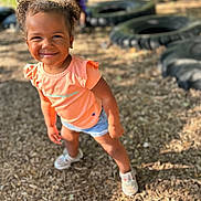 Amiyah joined the competition — help win amazing prizes! clothing, face, footwear, grass, happy, head, machine, outdoors, person, photography, plant, playarea, portrait, shoe, shorts, smile, sneaker, soil, tire, wheel