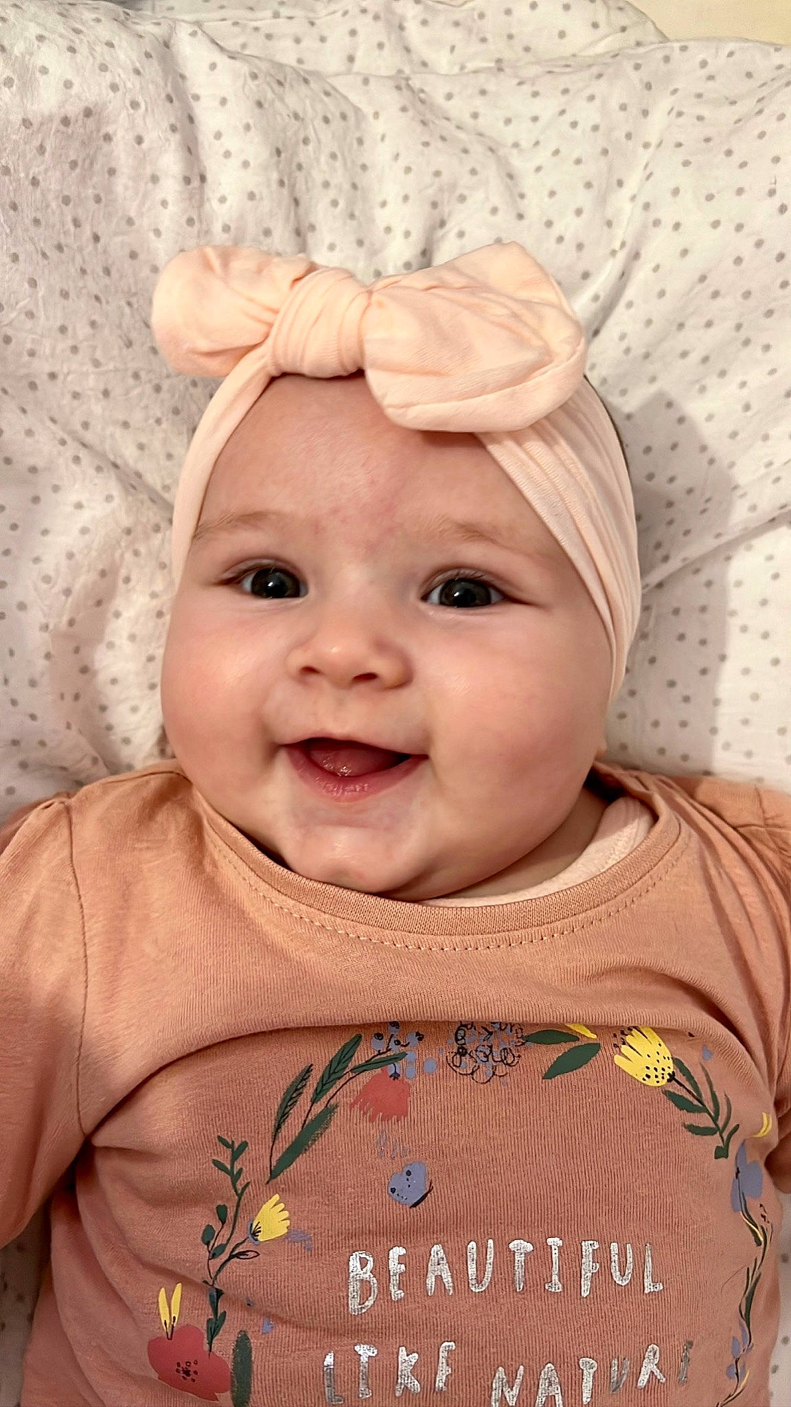 Hailey participe au concours pour gagner de l'argent avec cette photo : baby, baby_toddler_clothing, cheek, collar, eye, eyebrow, face, facial_expression, forehead, happy, head, headwear, iris, joy, lip, nose, outerwear, person, pink, skin