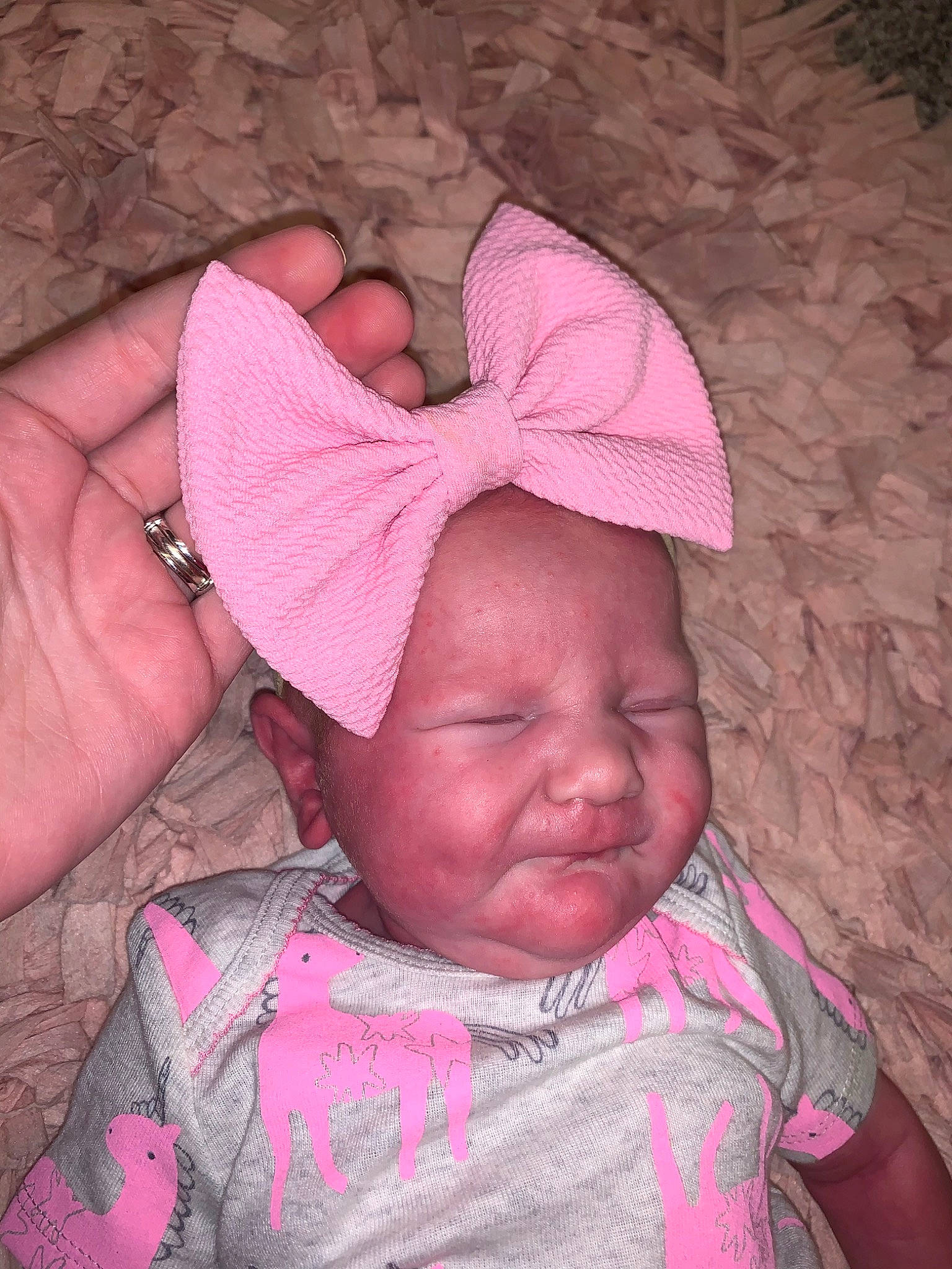 Kensington is registered to the contest to win money with this photo: baby, cheek, child, ear, forehead, hair_accessory, head, headgear, lip, person, pink, skin, toddler