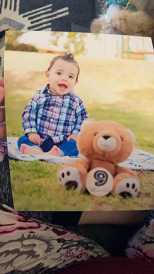 Alijah is registered to the contest to win money with this photo: bear, carnivore, child, facial_expression, fun, grass, happy, human, leisure, mammal, panda, person, plaid, recreation, snout, stuffed_toy, t_shirt, teddy_bear, toddler, toy