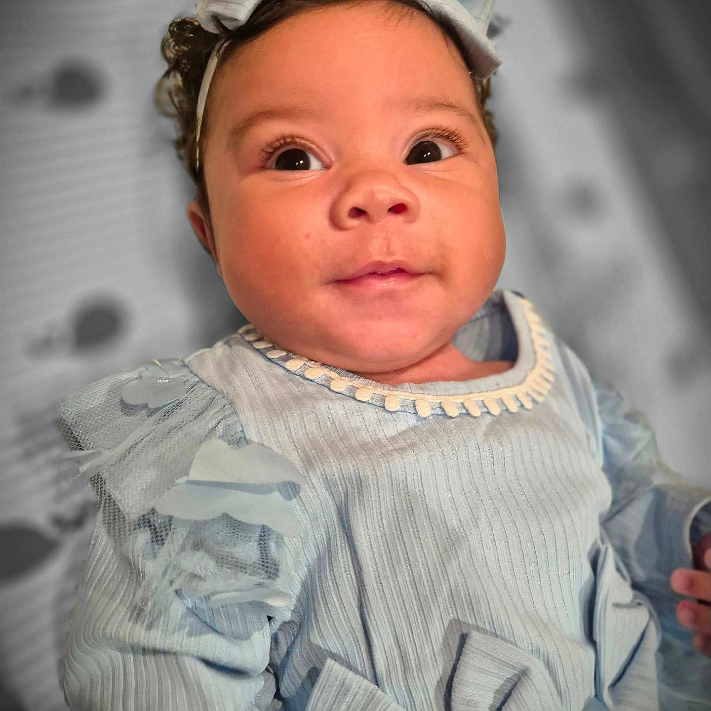 Ariyah is registered to the contest to win money with this photo: baby, bodypart, bonnet, cap, clothing, dress, face, finger, hand, happy, hat, head, longsleeve, newborn, person, photography, portrait, shirt, sleeve, smile