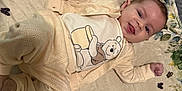 Locklynn is registered to the contest to win money with this photo: baby, infant, smiling, knitwear, winnie_the_pooh, milestone_blanket, numbers, heart_shape, lying_down, cozy, cute, celebration, soft_texture, playful, child, portrait, indoors, happy, toddler, clothing