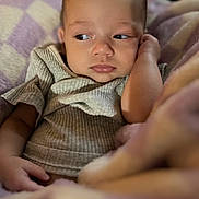 Riverlyn joined the competition — help win amazing prizes! baby, infant, child, face, expression, clothing, blanket, soft, cozy, texture, portrait, closeup, skin, hand, resting, indoor, cute, young, calm, comfortable