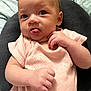 Riverlyn joined the competition — help win amazing prizes! baby, infant, tongue_out, pink_clothing, cushion, blanket, hand, face, skin, person, cute, lying_down, expression, indoors, soft_texture, newborn, head, eyes, small_fingers, cozy