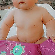 Paisley joined the competition — help win amazing prizes! baby, child, diaper, float, pink, seahorse, outdoor, face, skin, cute, butterfly_sticker, infant, playful, sitting, table, summer, chubby, expressionless, person, daytime
