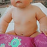 baby, child, diaper, float, pink, seahorse, outdoor, face, skin, cute, butterfly_sticker, infant, playful, sitting, table, summer, chubby, expressionless, person, daytime