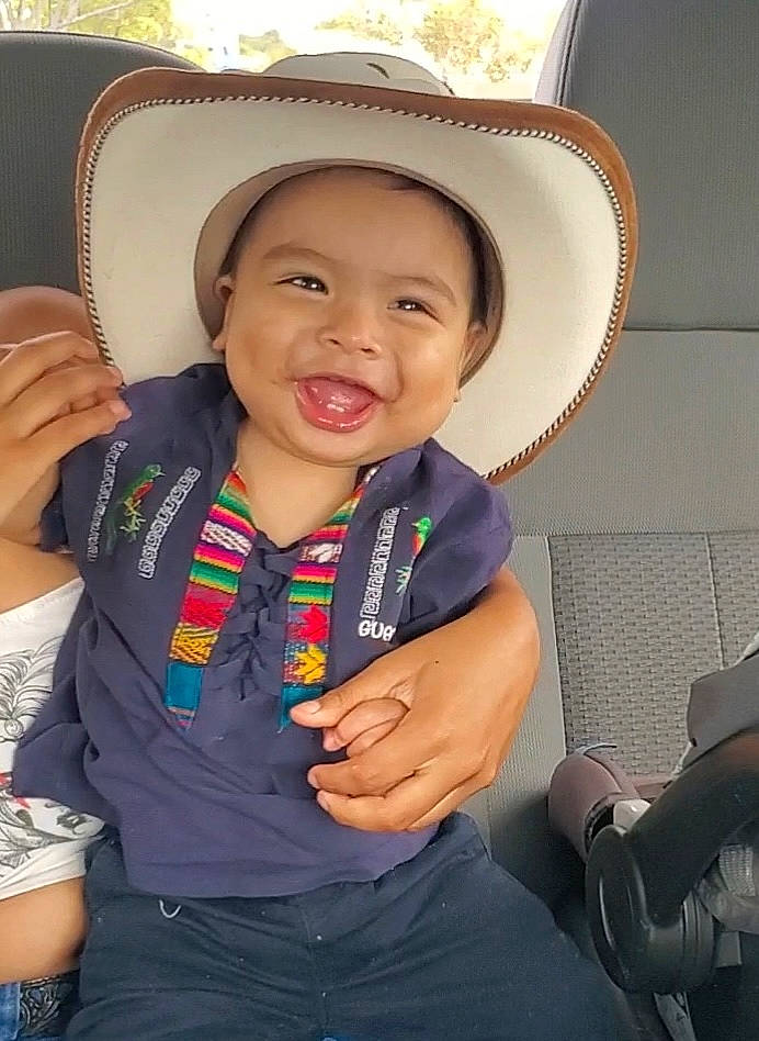 Aaron joined the competition — help win amazing prizes! auto_part, child, clothing, cool, electric_blue, eye, finger, fun, gesture, happy, hat, joy, leisure, neck, person, sitting, skin, smile, sun_hat, thumb