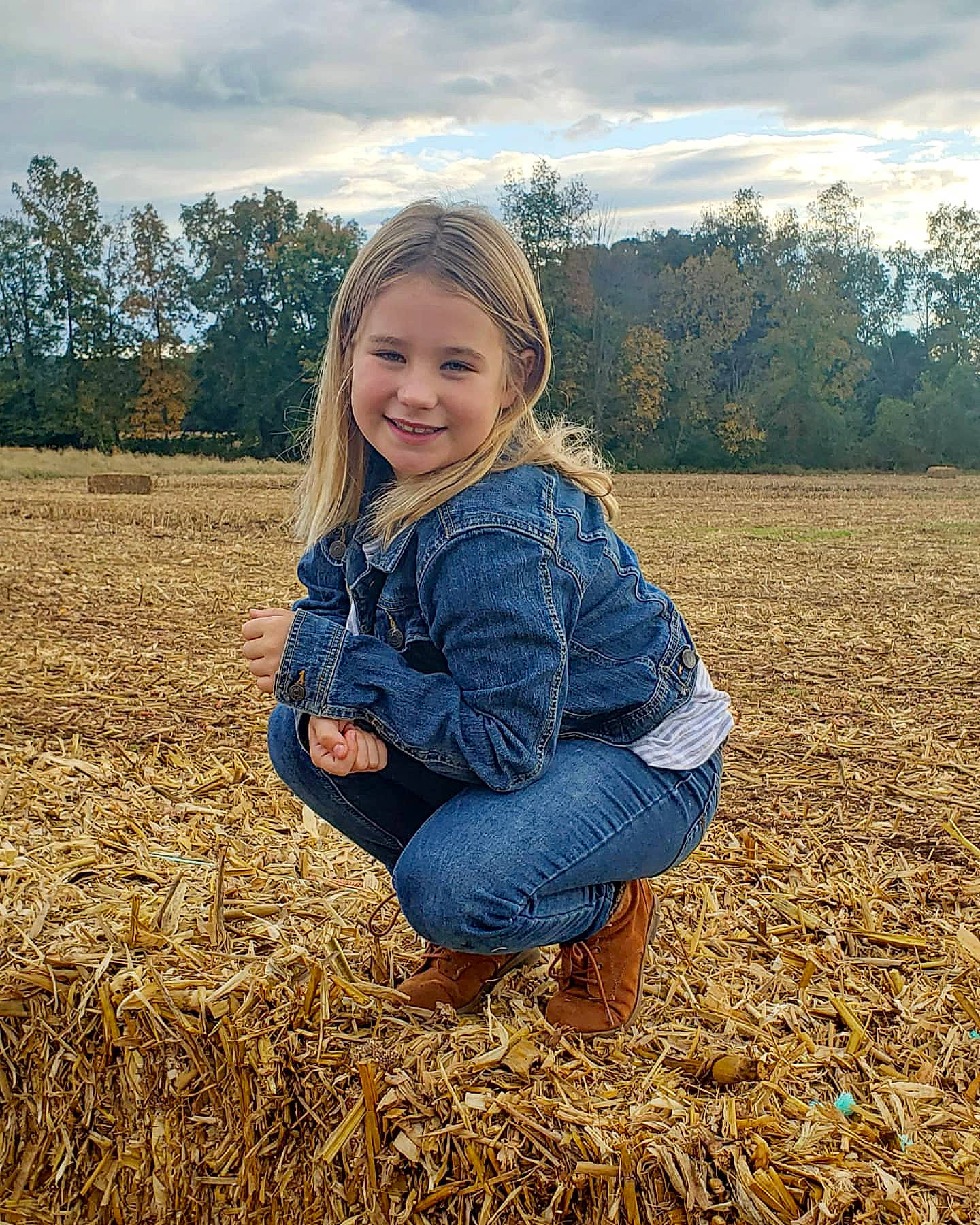Myla is registered to the contest to win money with this photo: agriculture, child, cloud, electric_blue, field, flash_photography, fun, grass, grass_family, grassland, happy, joy, people_in_nature, person, plain, plant, prairie, sky, smile, soil