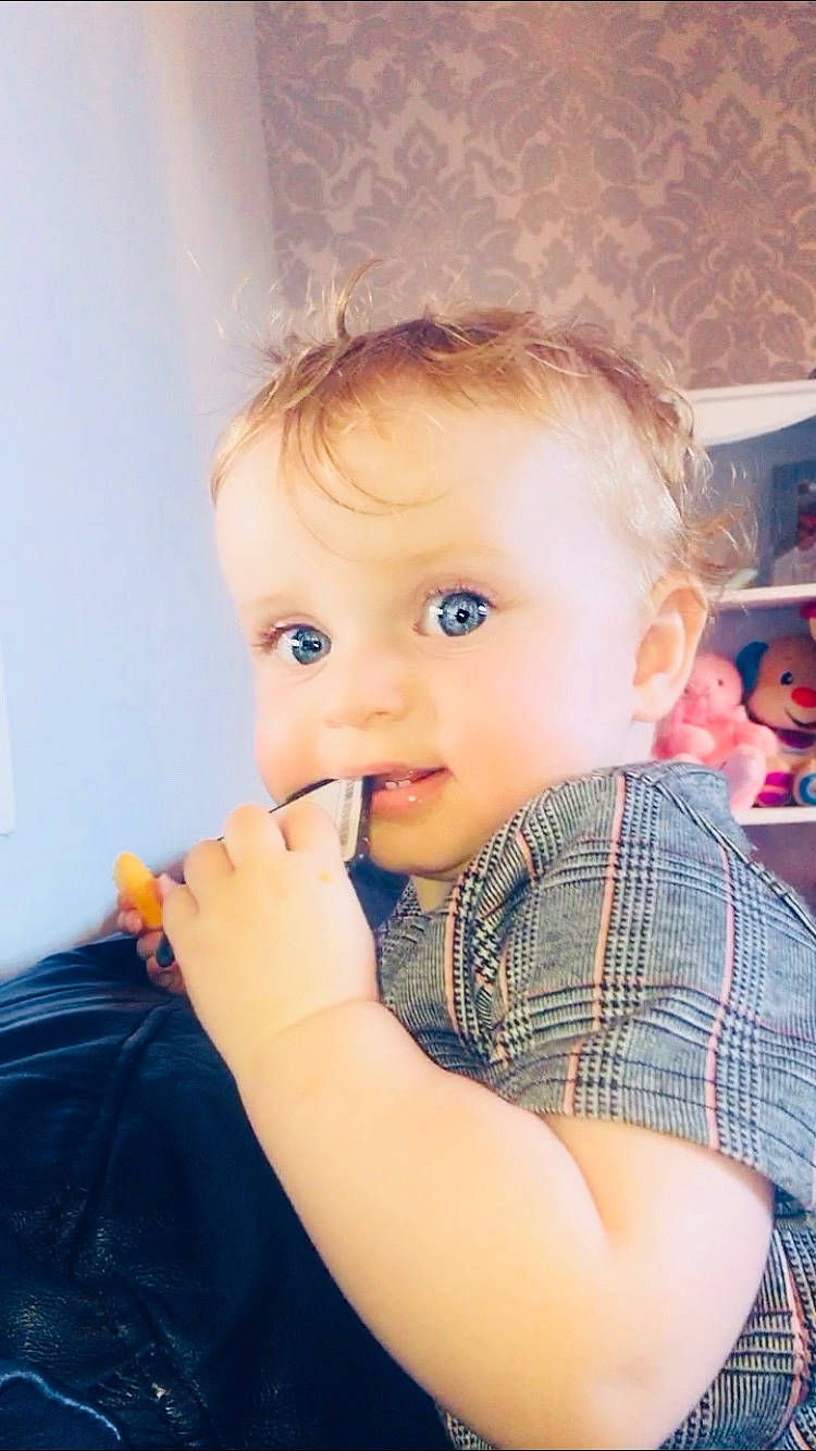 Olivia-rose is registered to the contest to win money with this photo: baby, blond, cheek, child, child_model, eating, eye, face, food, hair, lip, nose, person, skin, toddler