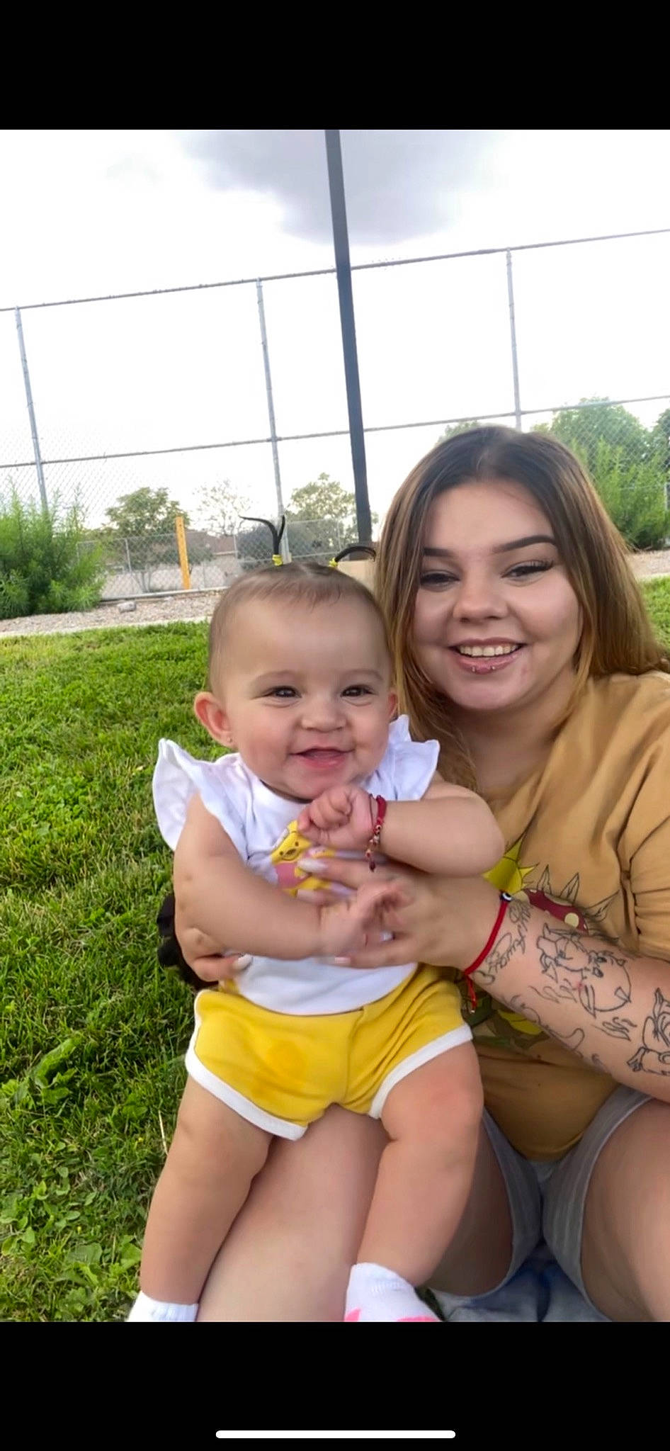 Everleigh joined the competition — help win amazing prizes! arm, face, finger, gesture, grass, hair, hairstyle, happy, head, interaction, iris, joy, leg, mouth, people_in_nature, person, plant, shorts, skin, sky