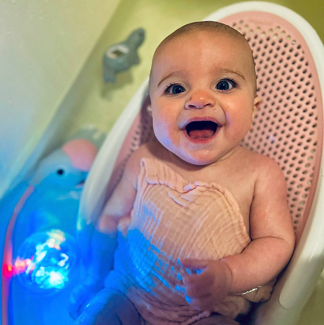 Braylyn is registered to the contest to win money with this photo: baby, baby_bathing, baby_playing_with_toys, baby_products, baby_safety, baby_toddler_clothing, bathing, cheek, child, fun, gesture, happy, iris, mouth, person, pink, product, purple, skin, smile