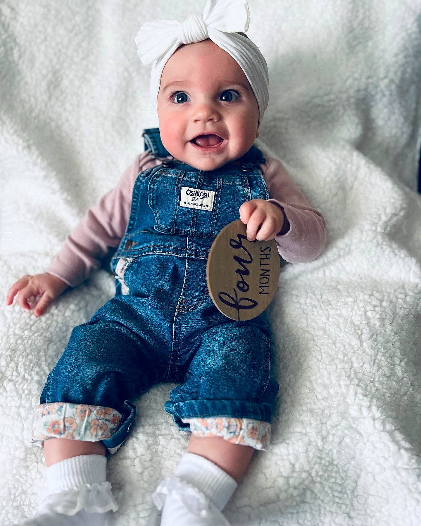 Braylyn is registered to the contest to win money with this photo: arm, azure, baby, baby_toddler_clothing, beauty, cap, child, eye, face, finger, gesture, hand, happy, headwear, person, skin, sleeve, smile, t_shirt, textile