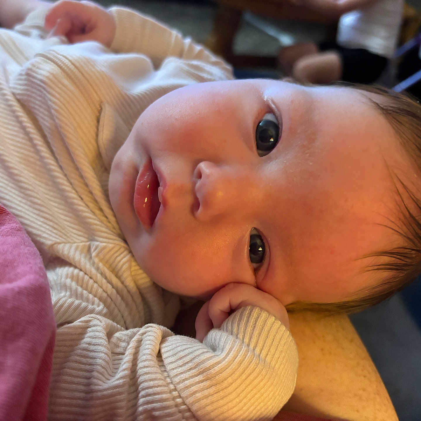 Magnolia is registered to the contest to win money with this photo: baby, bodypart, clothing, couch, eating, face, finger, food, furniture, hand, happy, head, knitwear, mouth, newborn, person, photography, portrait, smile, sweater