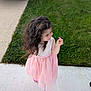 Snezhana joined the competition — help win amazing prizes! casual, child, concrete, curly_hair, daylight, flower, footwear, girl, grass, greenery, happy, holding, nature, outdoor, pink_dress, portrait, sidewalk, small_flower, smiling, suburban