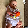 Phoebe-Lin is registered to the contest to win money with this photo: baby, child, toy, white_clothing, carpet, indoor, infant, playing, colorful_toy, barefoot, candid, floor, skin, hands, legs, light, expression, closeup, casual, relaxed