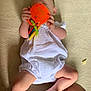 Phoebe-Lin is registered to the contest to win money with this photo: baby, infant, toy, orange_toy, white_clothing, carpet, legs, hand, foot, skin, child, person, indoor, playing, crawling, cute, relaxing, colorful, soft_texture, casual